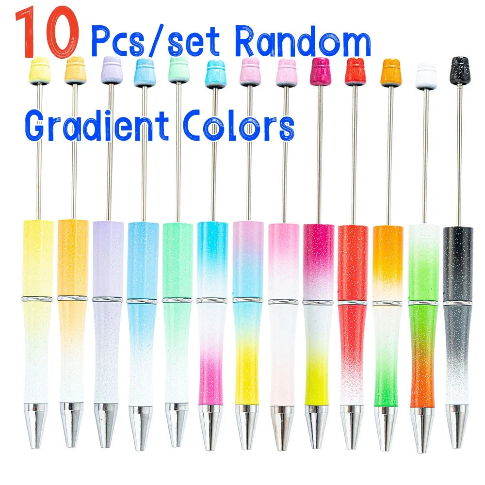 A set of ten gradient colored ballpoint pens in various shades including yellow, pink, green, and orange.