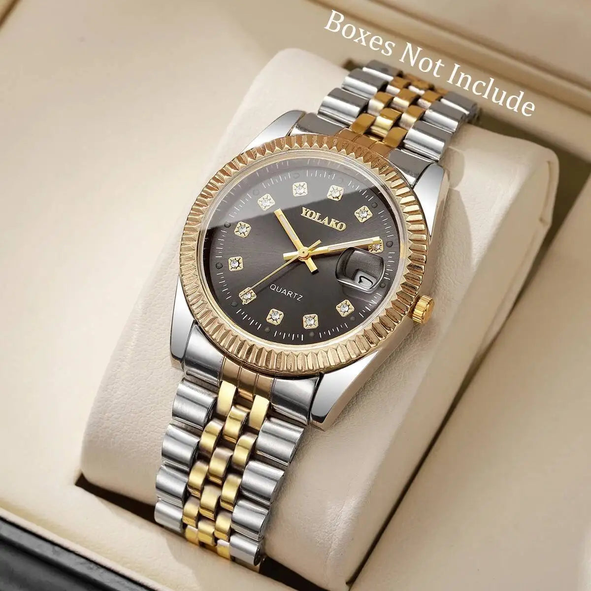 A gold-toned quartz wristwatch with a silver bracelet and round face is displayed on a light background.