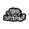 Black enamel lapel pin featuring the text ADHD is my superpower with lightning bolt accents.