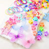 A collection of colorful decorative hair accessories including rings, star shapes, and butterfly clips on a white surface.