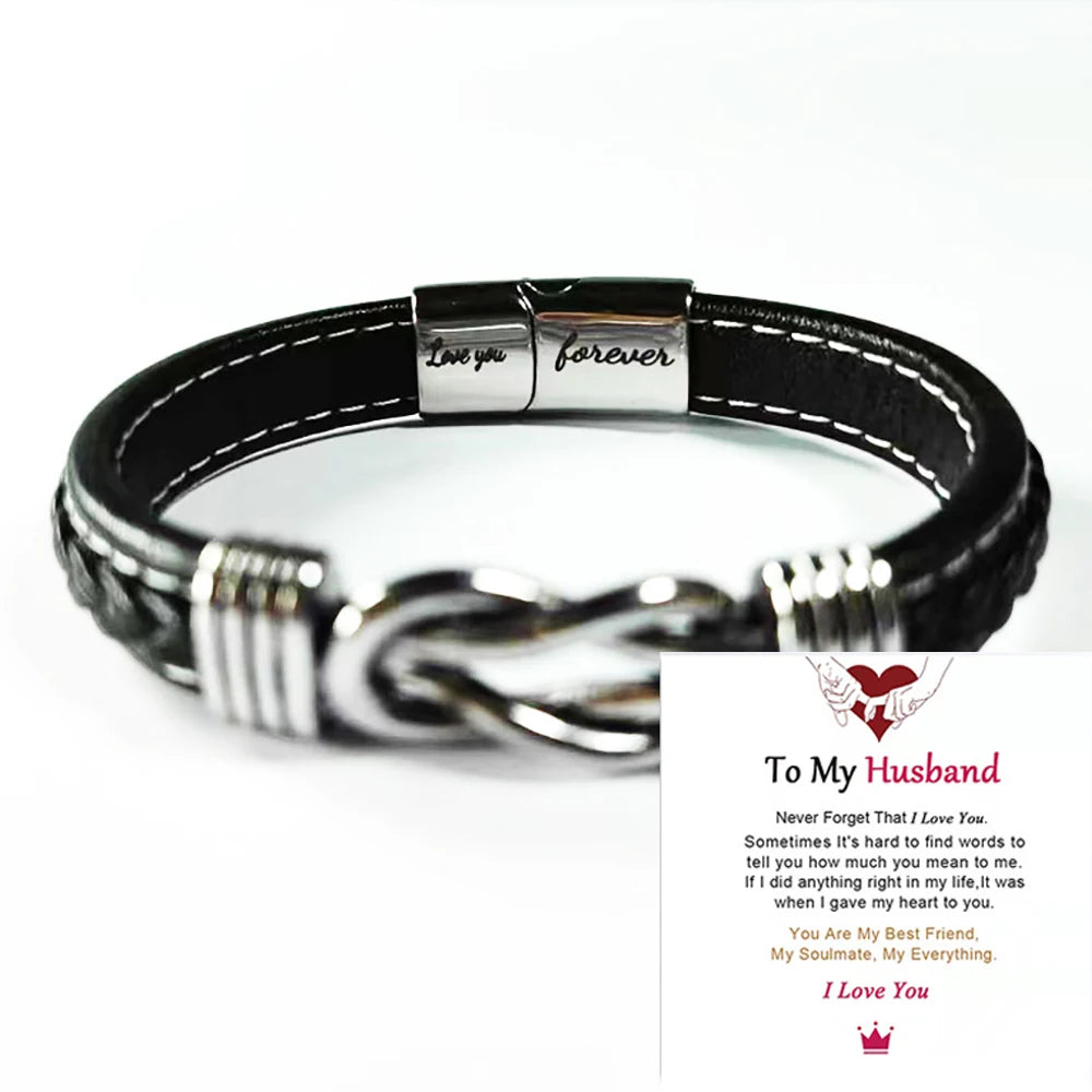 A black leather knot bracelet with a silver engraving that reads I love you forever