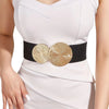 White dress with a black elastic waist belt featuring gold circular embellishments