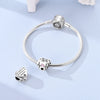 Sterling silver devil's eye charm bracelet with a heart pendant and a charm on the clasp