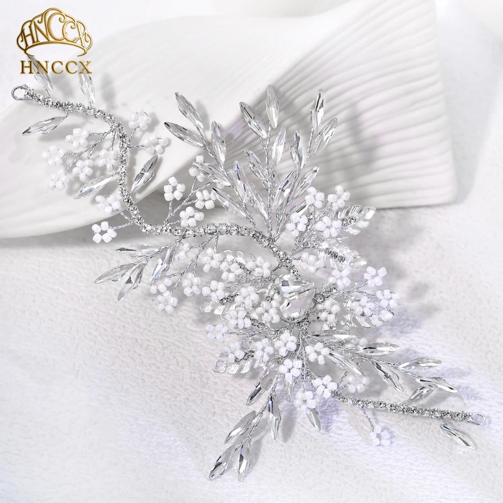 Silver rhinestone bridal headband featuring delicate floral and vine designs