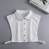 White blouse with a false collar and button-down front, displayed on a gray background.