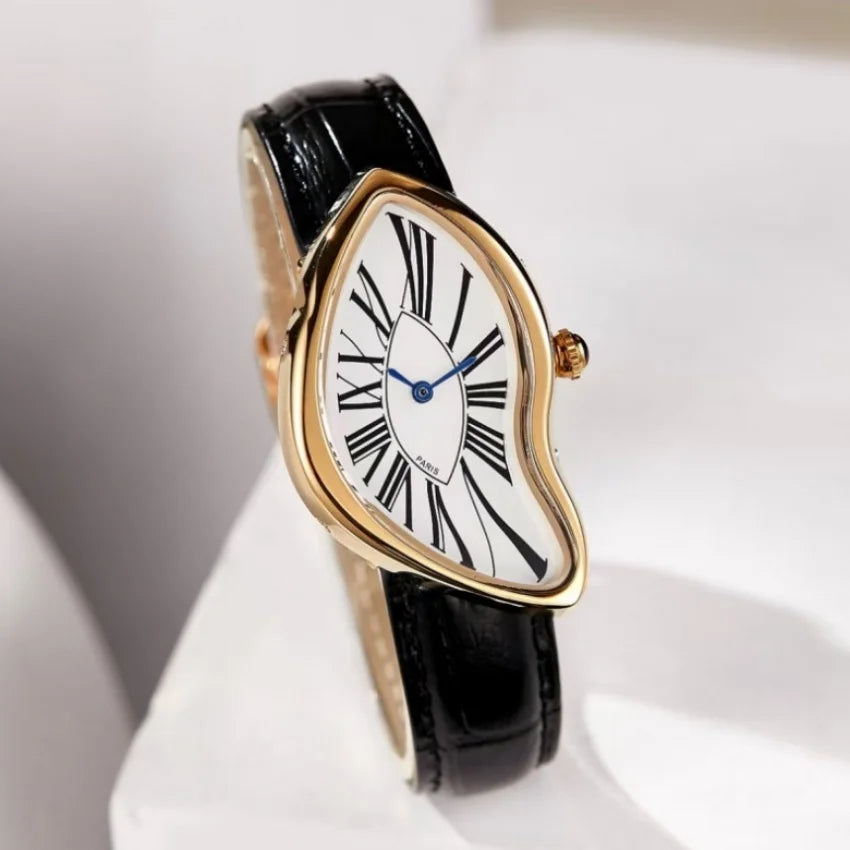 A vintage irregular quartz watch with a gold-toned bezel and white face is shown on a black strap.