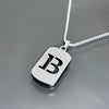 A silver stainless steel pendant necklace featuring a large initial letter B on a chain.