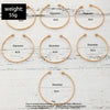 A set of gold hexagon star twist bangles shown in various sizes and angles on a white wooden background.