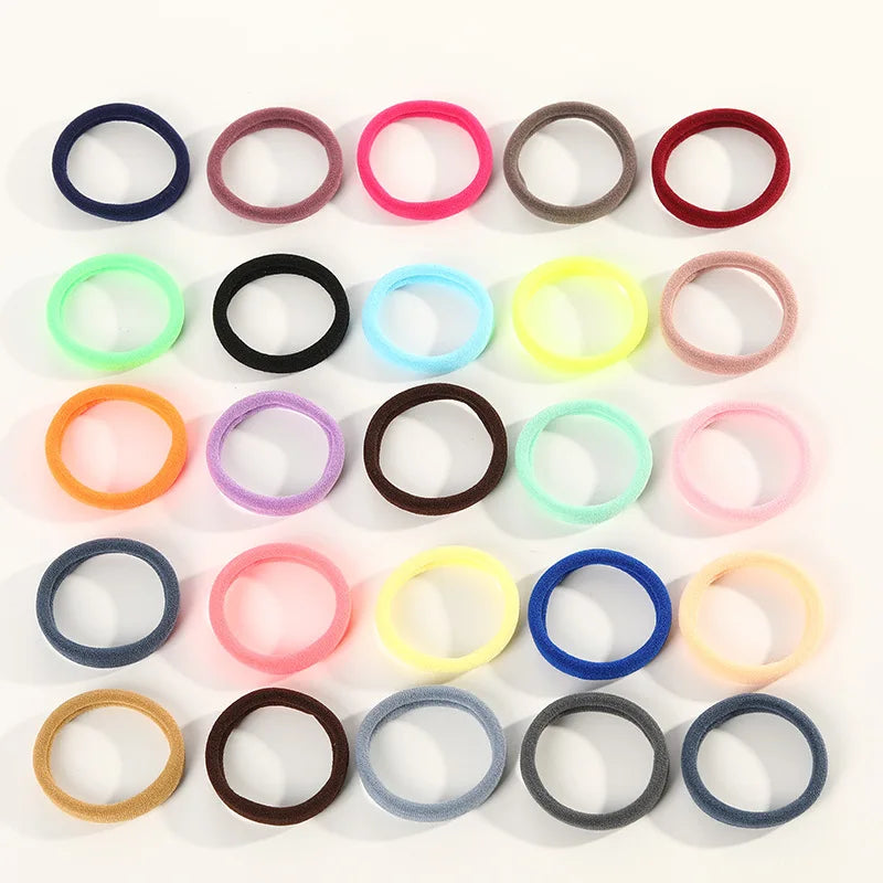 A collection of 20 colored elastic hair ropes arranged in a grid.