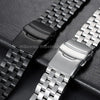 A close-up of an adjustable stainless steel watch band shown in black and silver finishes.