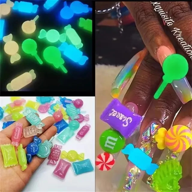 A collection of colorful resin nail art charms and embellishments displayed on a hand.