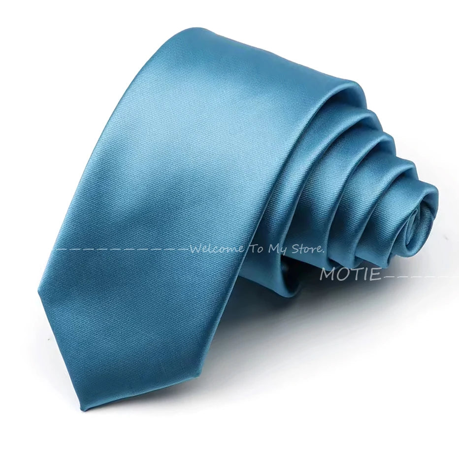 A folded teal satin neck tie for formal wear.