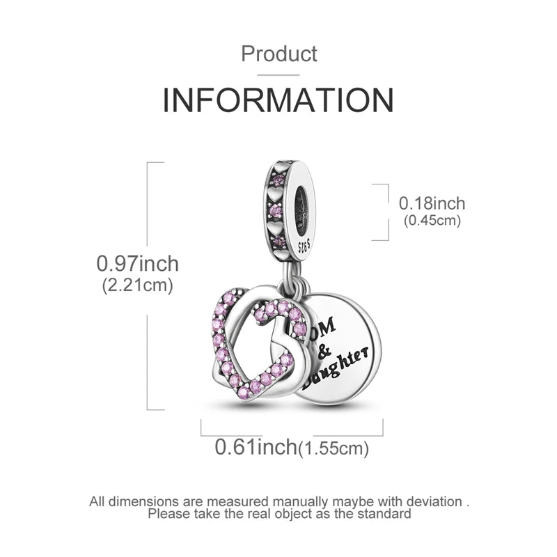 Sterling silver star moon charm bracelet featuring a heart pendant and a dangling charm.