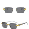 Gray gradient sunglasses with gold accents displayed against a white background.