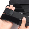 A hand is holding black elastic wig bands for hair edges.