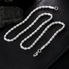 A set of twisted rope necklaces and bracelets made of 925 sterling silver displayed on a black surface.