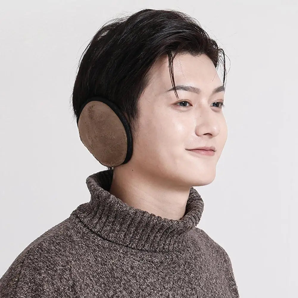 A close-up profile shot of a person wearing brown knitted earmuffs for cold weather protection.