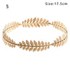 A gold leaf headband featuring olive or laurel leaves for bridal and party accessories.
