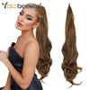 A model showcases long brown hair extensions styled in a ponytail, demonstrating the texture and length of the synthetic wrap