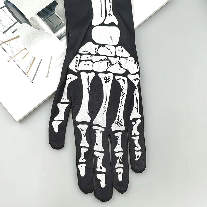 Black gloves with a white skeleton hand design showing the bones of the fingers and palm.