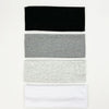A set of four knitted hair bands in black, gray, light gray, and white.