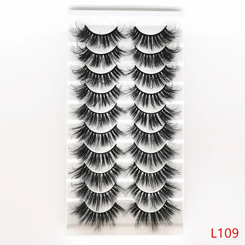 A strip of dramatic mink false eyelashes displayed on a clear card.