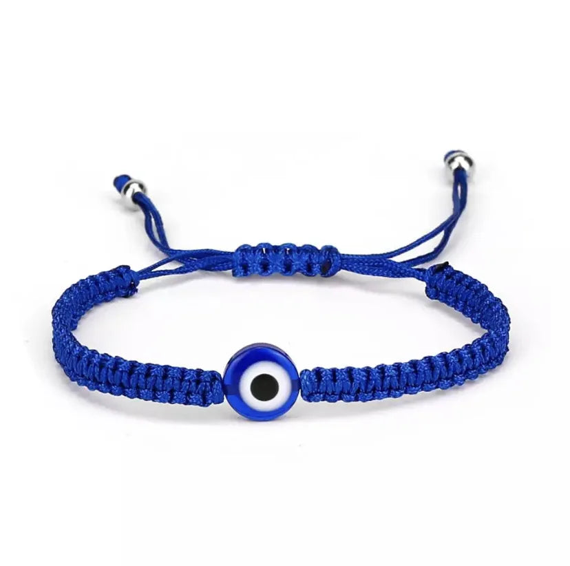 Blue Turkish Evil Eye charm bracelet with a black and white eye bead.