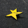 A yellow star shaped enamel pin with the text your did it on a black surface.