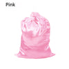 A pink satin drawstring storage bag is shown.