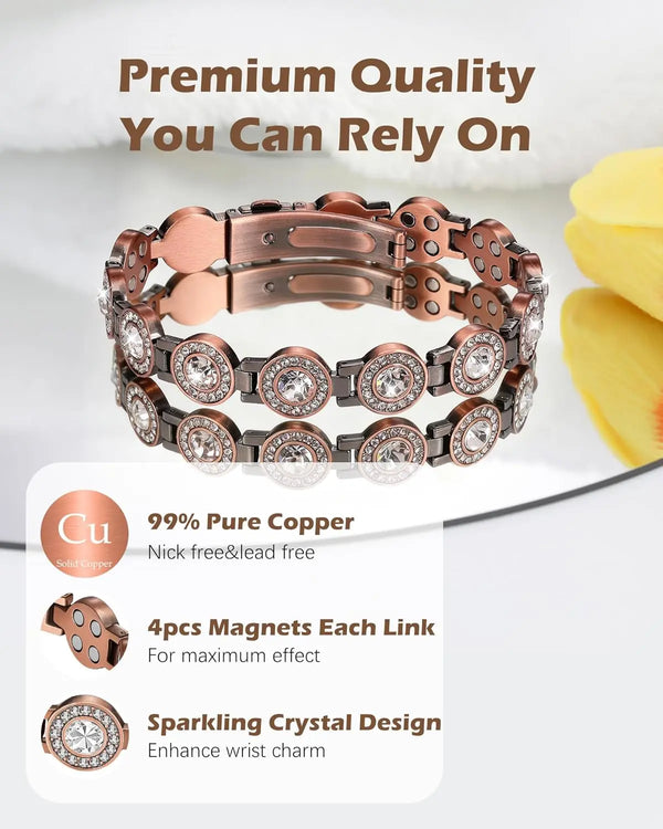 A close-up of a rose gold copper bracelet featuring sparkling crystal designs and magnetic links.