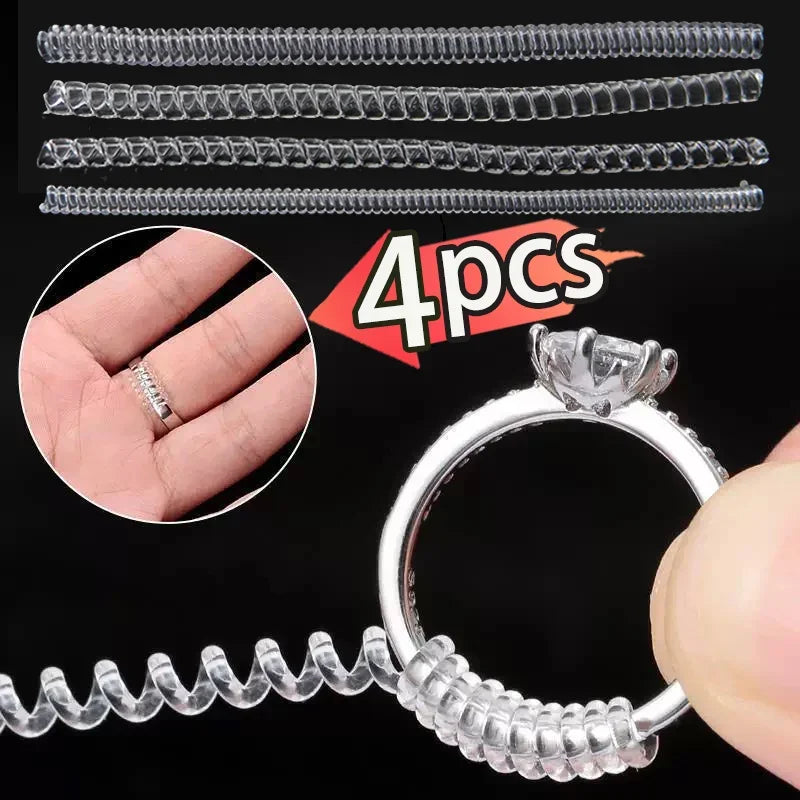 A set of four clear invisible ring size adjusters, including multiple sizes and a finished ring.