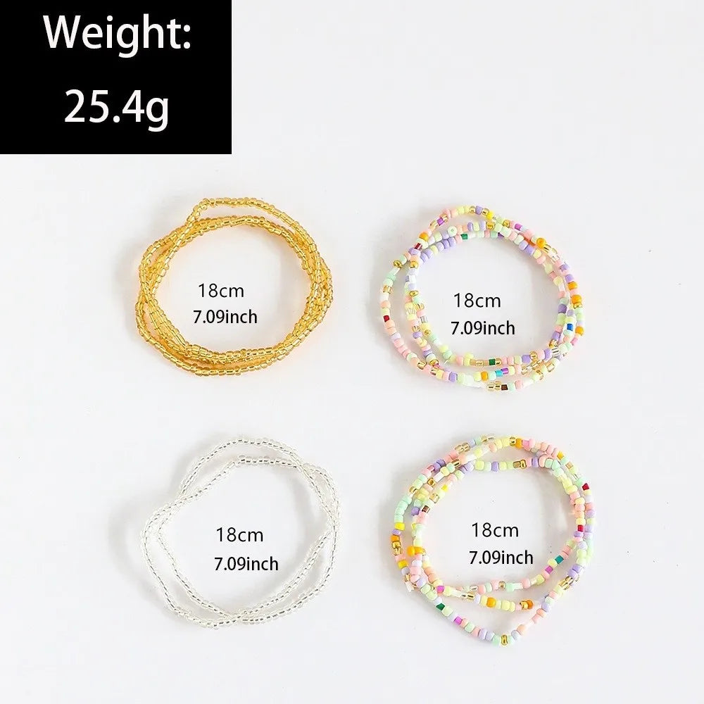 A stack of three beaded bangles, featuring light colors and clear beads, with a weight of 25.4g.