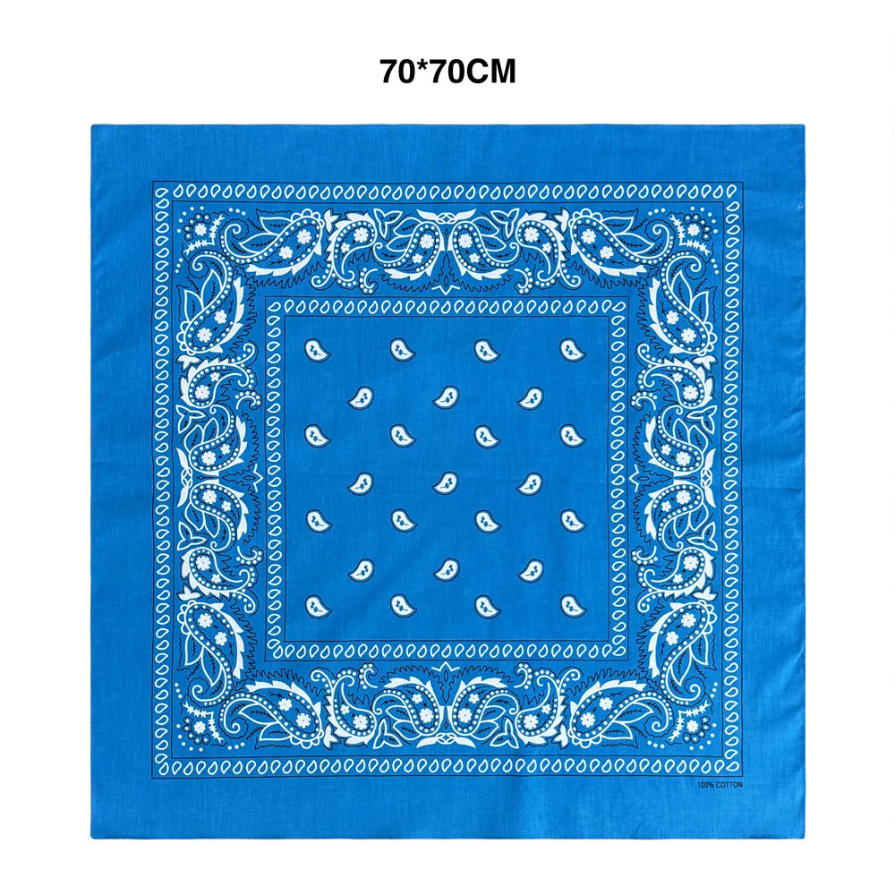 Blue fabric square featuring white paisley and floral embroidery pattern
