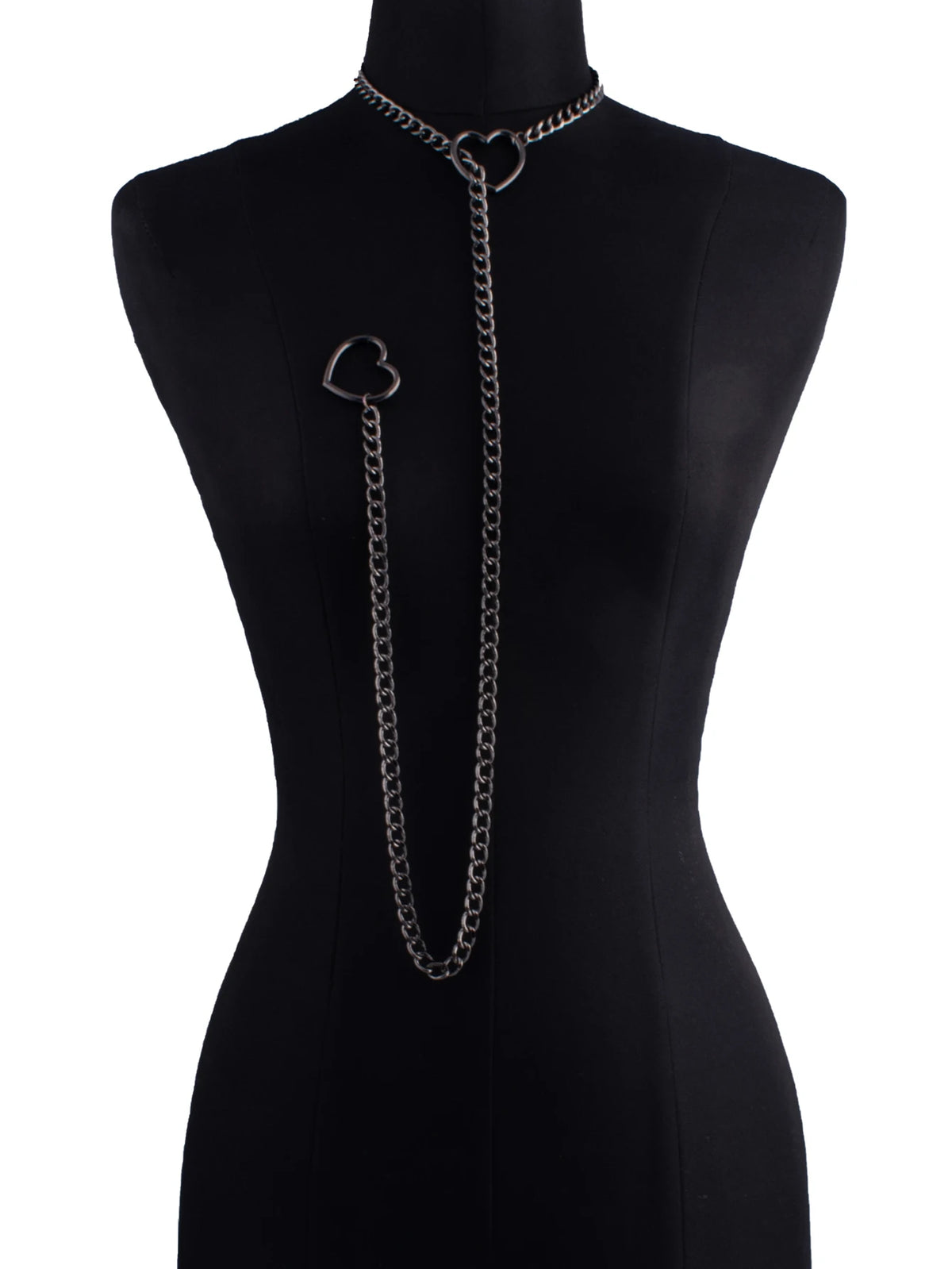 A black slip chain necklace with a heart pendant displayed on a black mannequin.