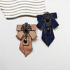 Elegant handcrafted solid color tie in navy blue and copper with diamond embellishments