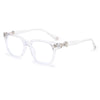 Clear plastic square eyeglasses with a silver decorative detail on the temple.