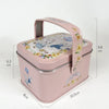 A pink decorative tinplate candy box with a carrying loop featuring a white rabbit design.