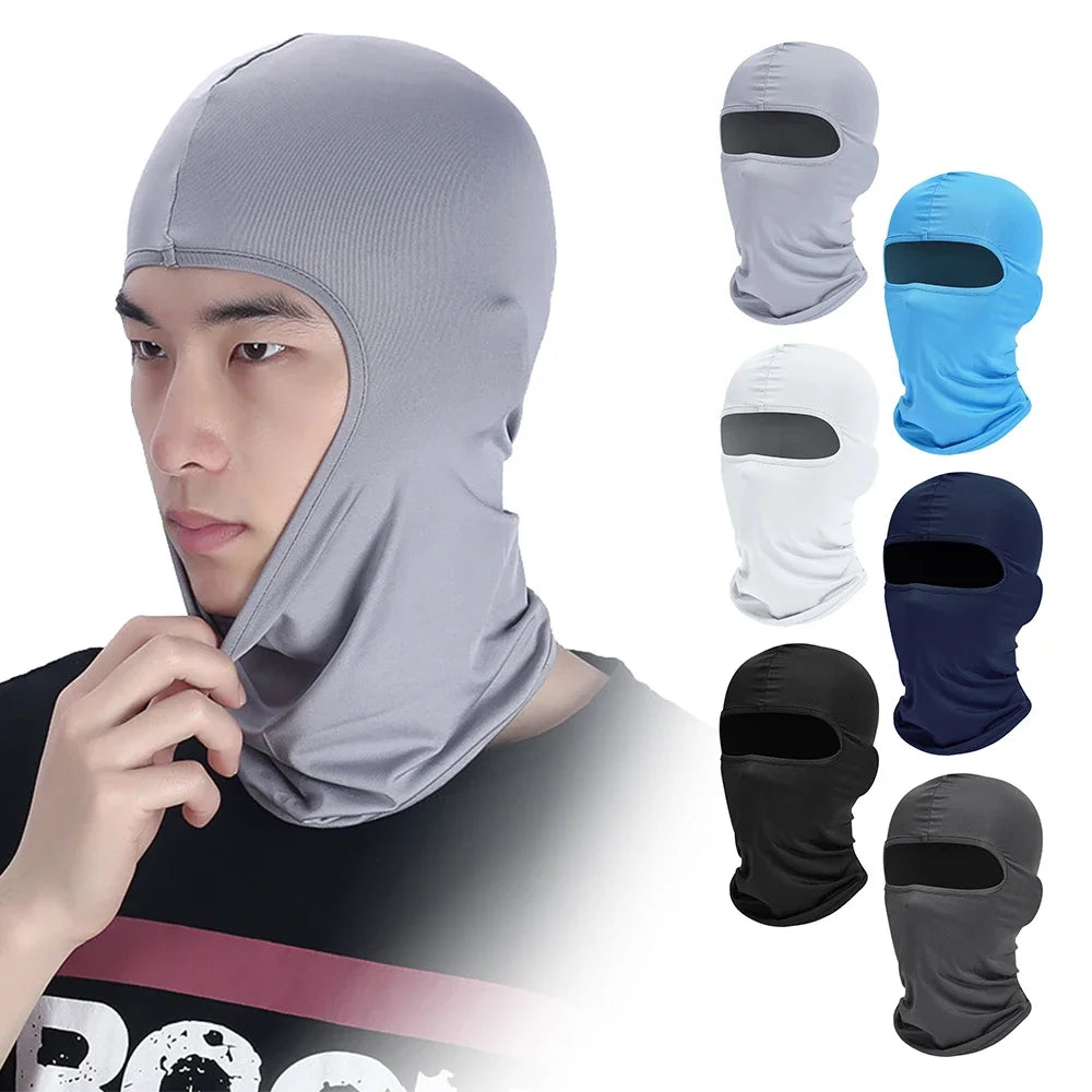 A man wearing a gray tactical full face balaclava with various color options displayed beside him.