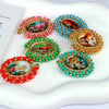 A collection of gold plated copper pendant necklaces featuring colorful enamel work and Miyuki beads.