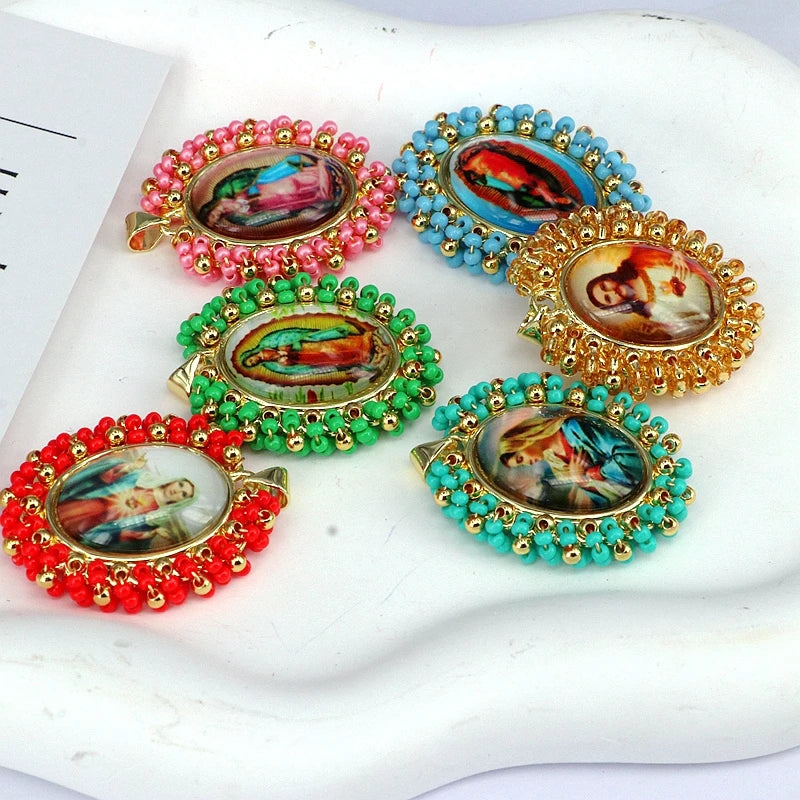 A collection of gold plated copper pendant necklaces featuring colorful enamel work and Miyuki beads.