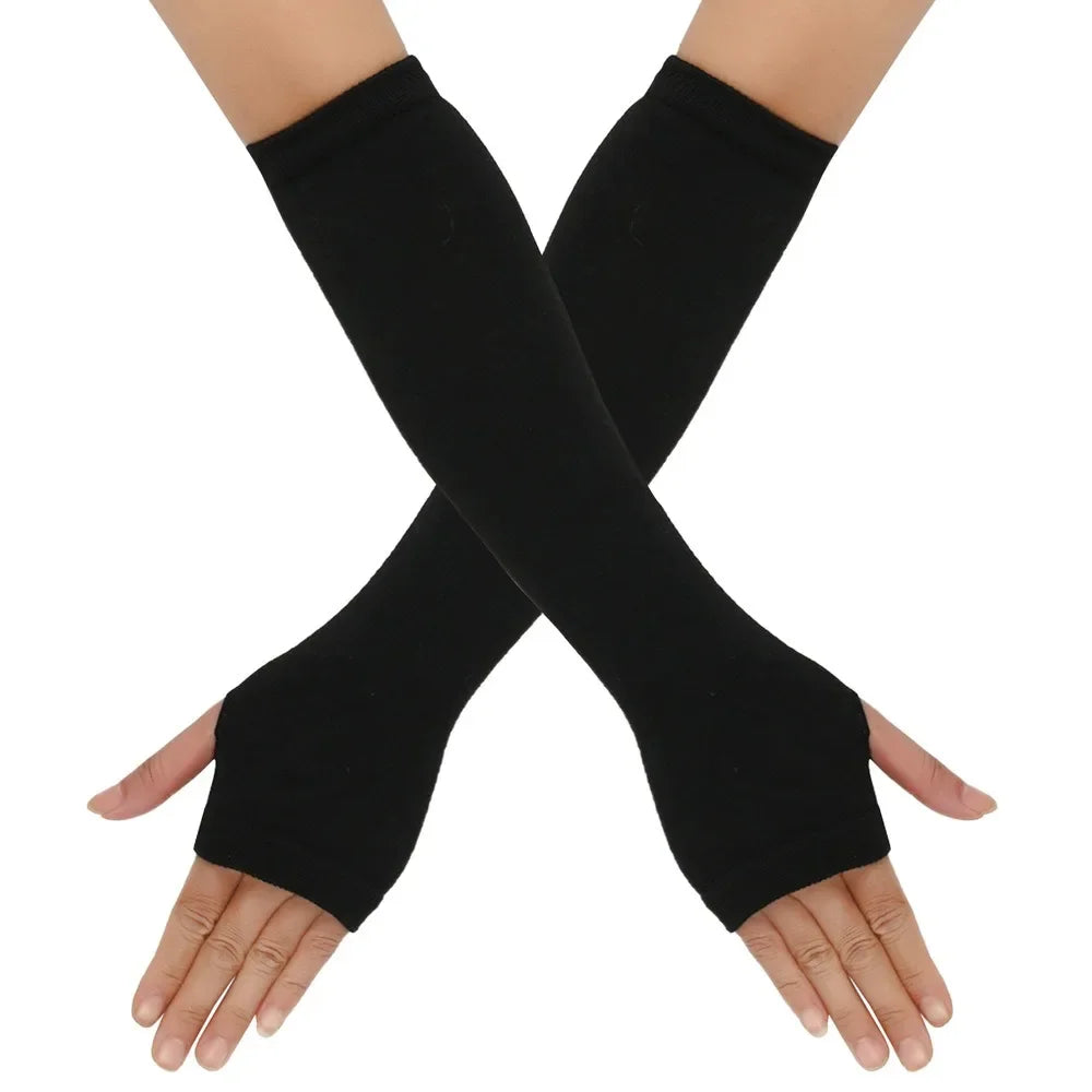Black knitted fingerless gloves crossed on a hand
