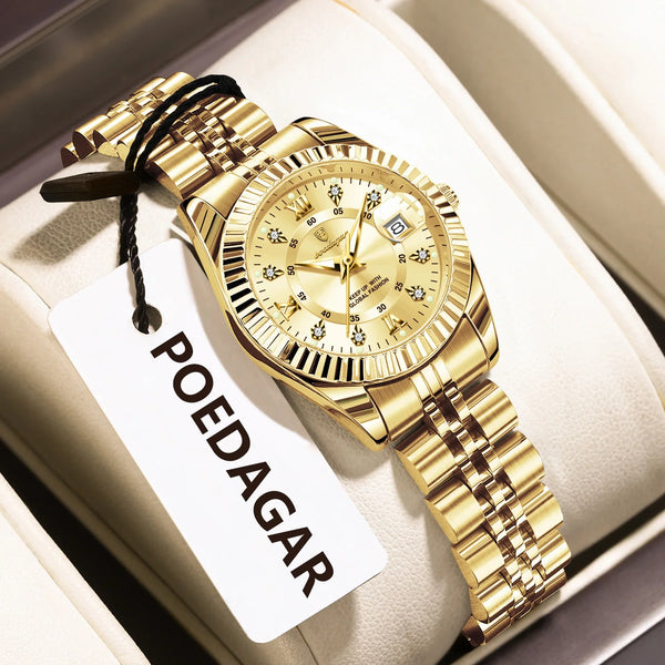 A gold-toned ladies wristwatch with a metal bracelet is displayed on a white card.