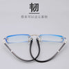 A pair of clear, frameless reading glasses with thin metal frames and blue tinted lenses displayed against a light gray backg
