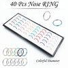 A display of 40 colorful stainless steel nose rings and stud piercings.