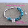 Sterling silver bracelet featuring natural turquoise stone beads and a butterfly charm