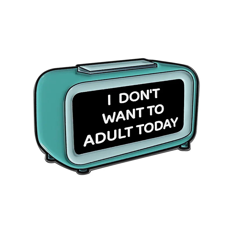 A teal enamel lapel pin shaped like a rectangular box with the text I DON'T WANT TO ADULT TODAY engraved on it.