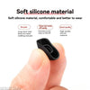 A hand is holding a black silicone ear tip product for true wireless earbuds.