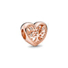 Rose gold heart pendant featuring a detailed cherry blossom design and small diamonds