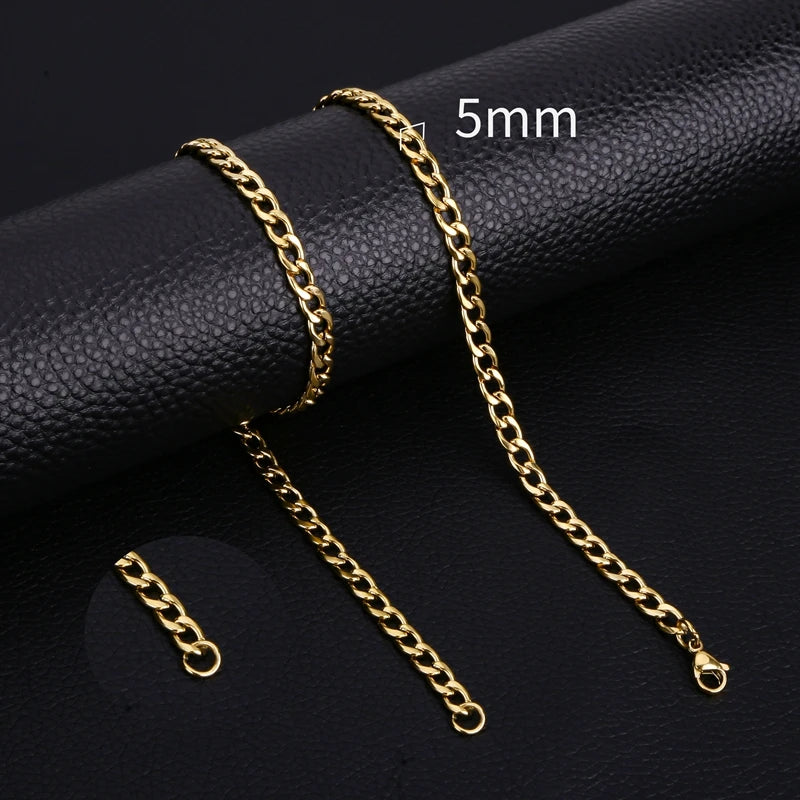 Gold-colored stainless steel Cuban link necklace displayed on a black background with a 5mm scale marker.