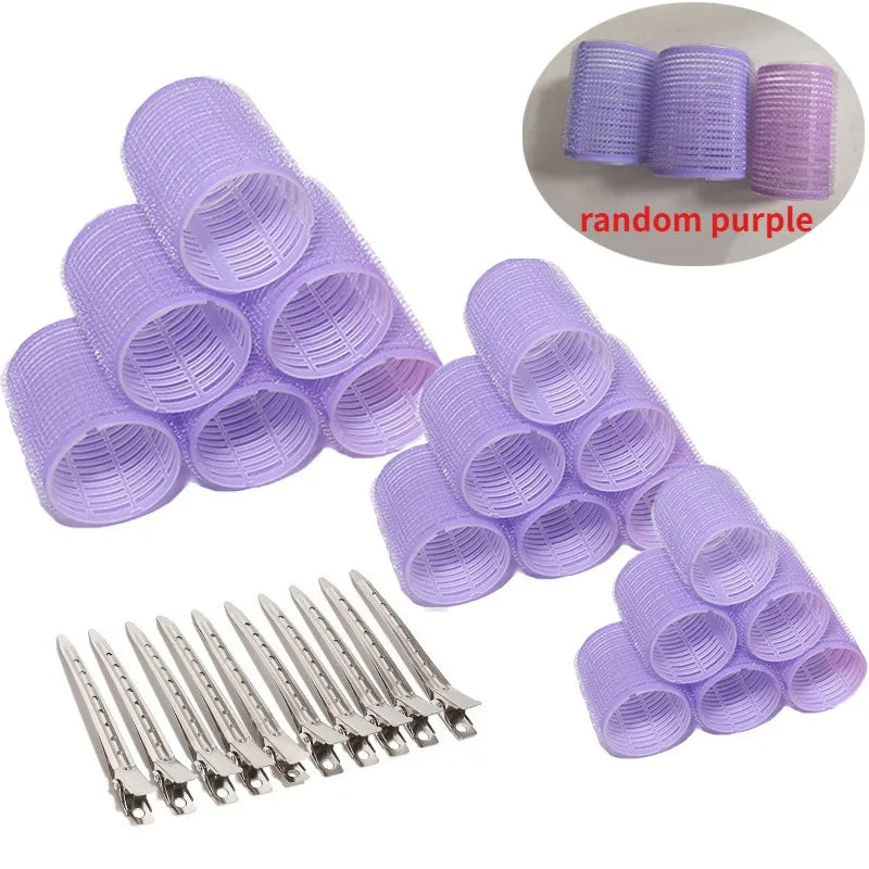 A set of purple heatless hair curlers and a pack of metal hair pins for DIY styling.